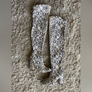 Over the knee snake boots